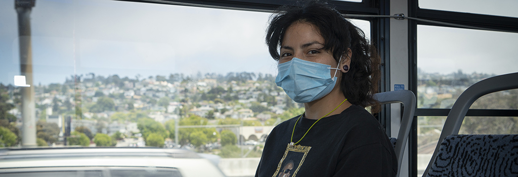 Woman with mask commuting