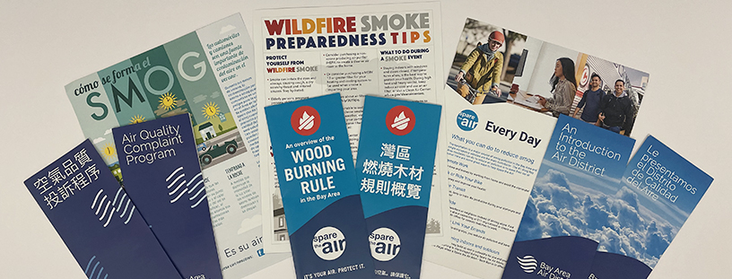 Display of various Air District brochures in several languages