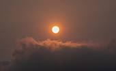 Wildfire smoke and orange sun