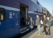 Commuters entering train