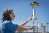 Staff member adjusting monitoring device