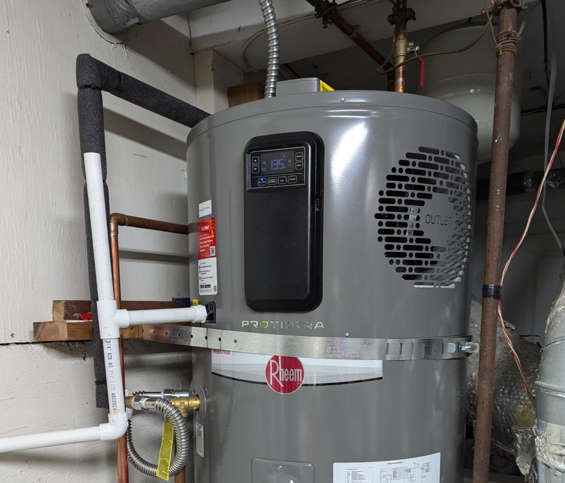 An electric heat pump water heater. 